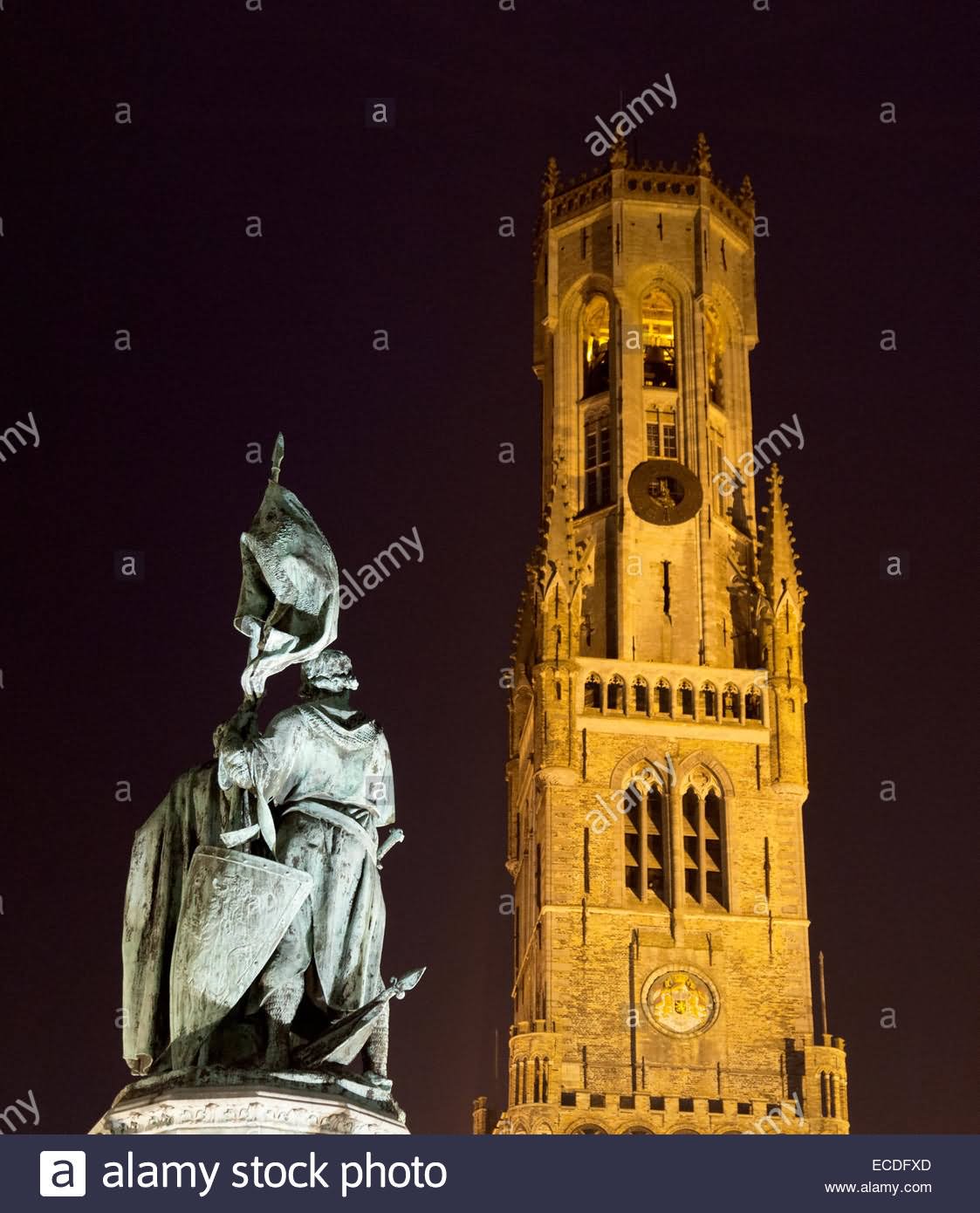 The Statue of Jan Breydel and Pieter de Coninck In Front Of Belfry Of Bruges At Night