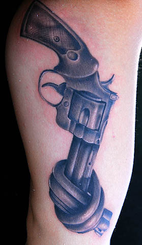 Black And Grey Revolver Tattoo On Arm Sleeve