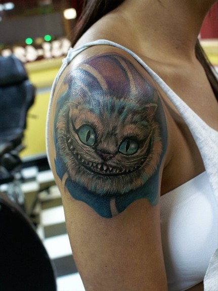 Cheshire Cat Tattoo On Girl Right Shoulder