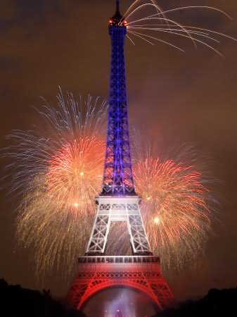 Eiffel Tower Illuminated During The Bastille Day Fireworks Display