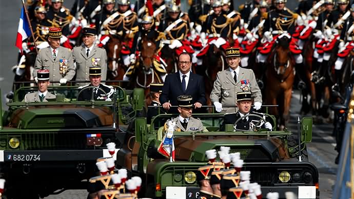 France President Francois Hollande And French Army Chief Of Staff Ride In A Command Car During The Bastille Day Parade