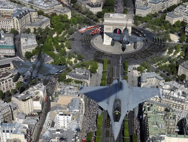 French Rafale Jet Flies Over The Arc de Triomphe In Paris During The Bastille Day Parade