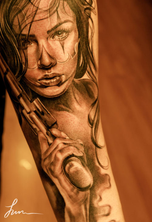 Girl With Revolver Tattoo On Arm Sleeve