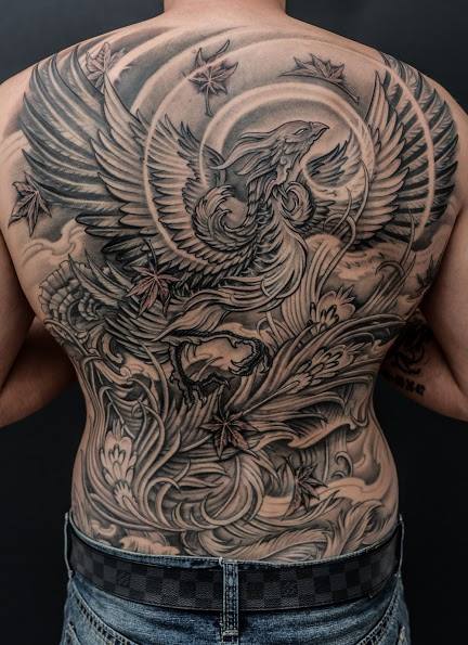 Grey Ink Phoenix Tattoo On Man Full Back