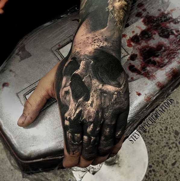 Realistic Grey Skull Tattoo On Left Hand