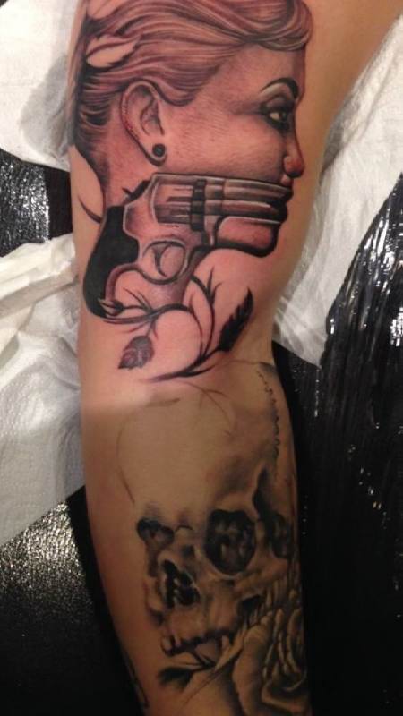 Revolver Tattoo On Right Sleeve