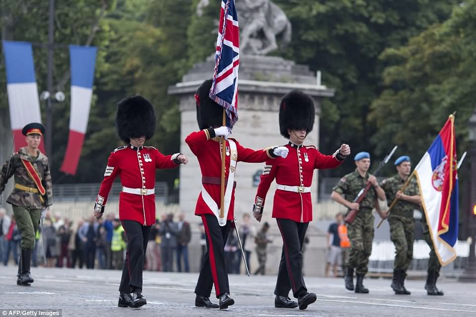 Three British Soldiers Take Part In Bastille Day Parade