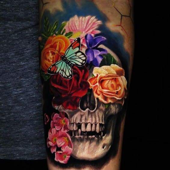 Skull In Colored Flowers Tattoo On Left Arm