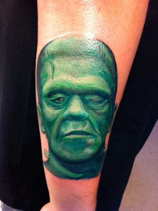 Green Ink Frankenstein Head Tattoo On Right Arm