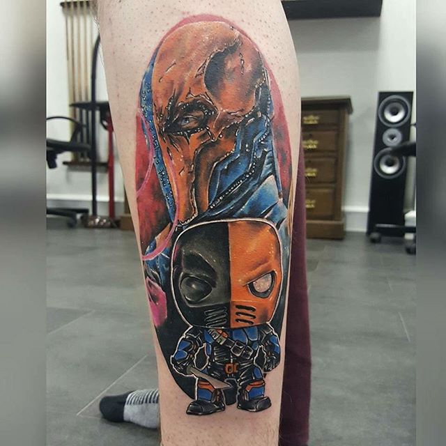 Deathstroke With Baby Tattoo On Left Leg