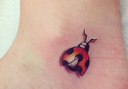 Cute Flying Ladybug Tattoo On Ankle