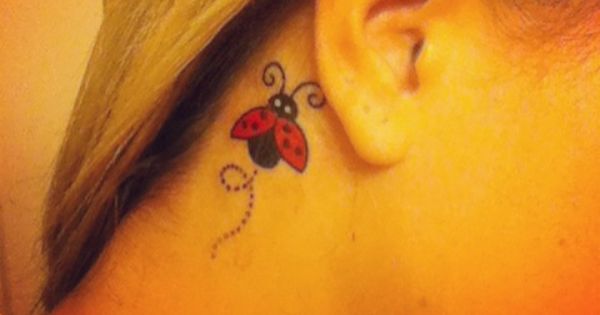 Flying Ladybug Tattoo Behind The Ear