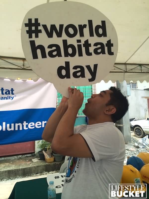 Man With World Habitat Day Note Picture