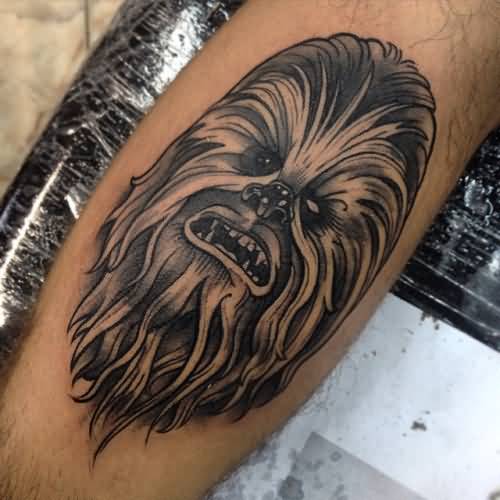 Black And Grey Chewbacca Head Tattoo On Leg