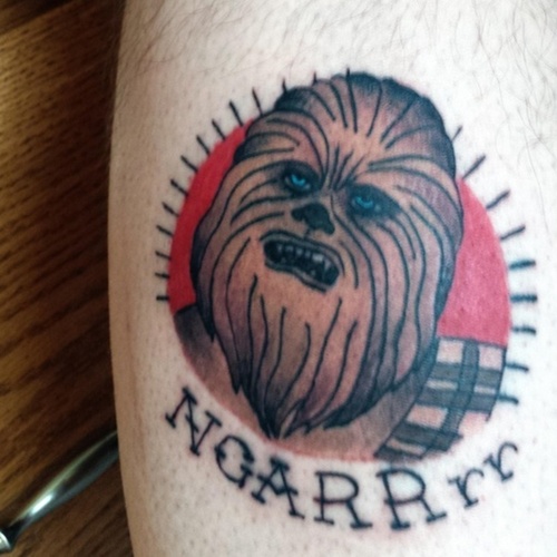 Grey Ink Chewbacca Head Tattoo