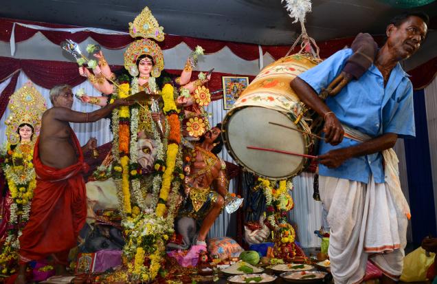 A Bengali Drummer Playing Beats At Durga Puja Celebrations