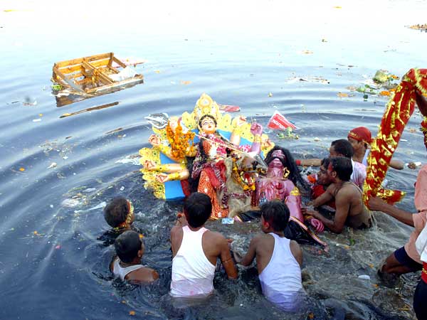 Goddess Durga Idol In Immersion Process During Durga Puja Celebration