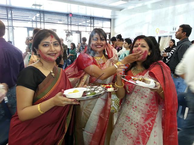 People Offering Sweets To Each Other During Durga Puja Celebration