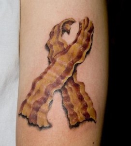 Bacon In Ribbon Shape Tattoo by Kate Moon