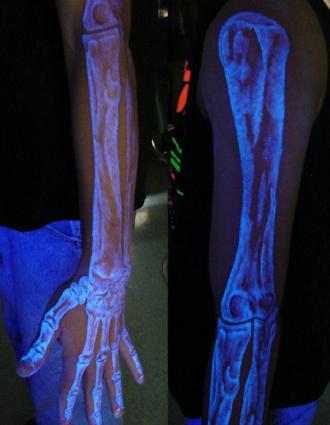 Black Light Skeleton Tattoo on Left Sleeve