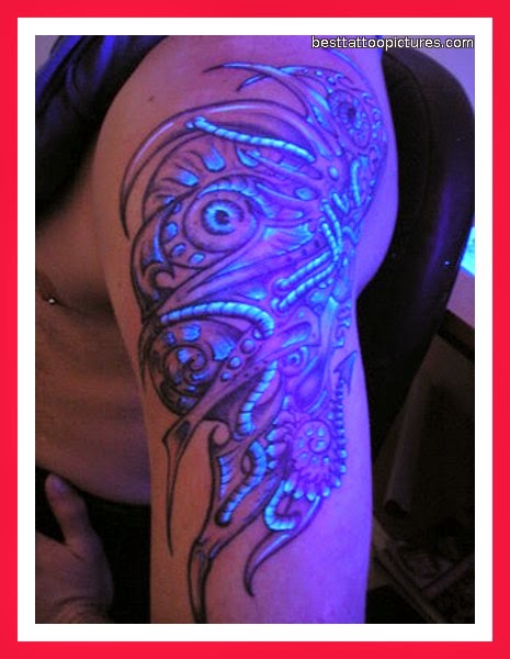 Black Light Tattoo On Left Shoulder