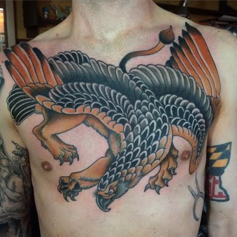 Colorful Brilliant Griffin Tattoo On Chest For Men