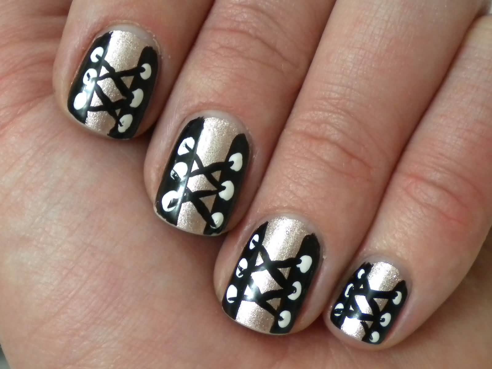 Metallic And Black Corset Nail Art