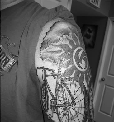 Awesome Cycle With Sun And Clouds Tattoo On Right Shoulder