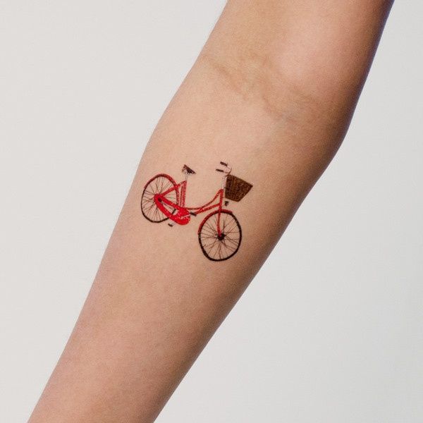 Brilliant Small Red Color Cycle Tattoo On Forearm