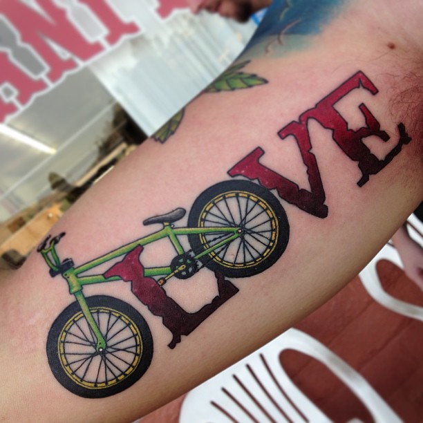 Creative Love Cycle Tattoo On Bicep