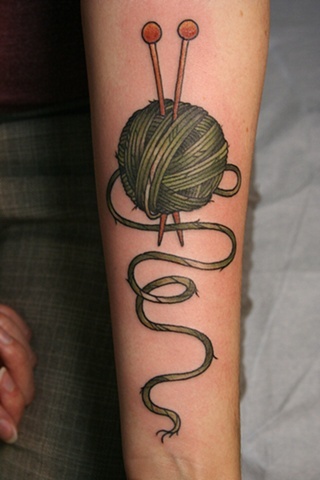 Green Craft Yarn Tattoo On Forearm