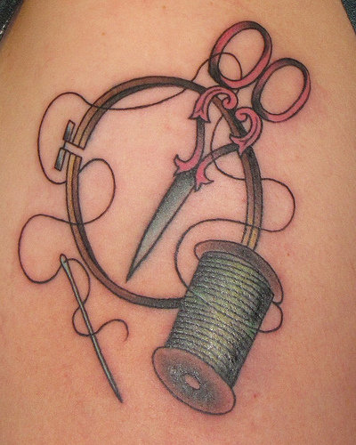 Green Spool And Craft Tattoo On Shoulder