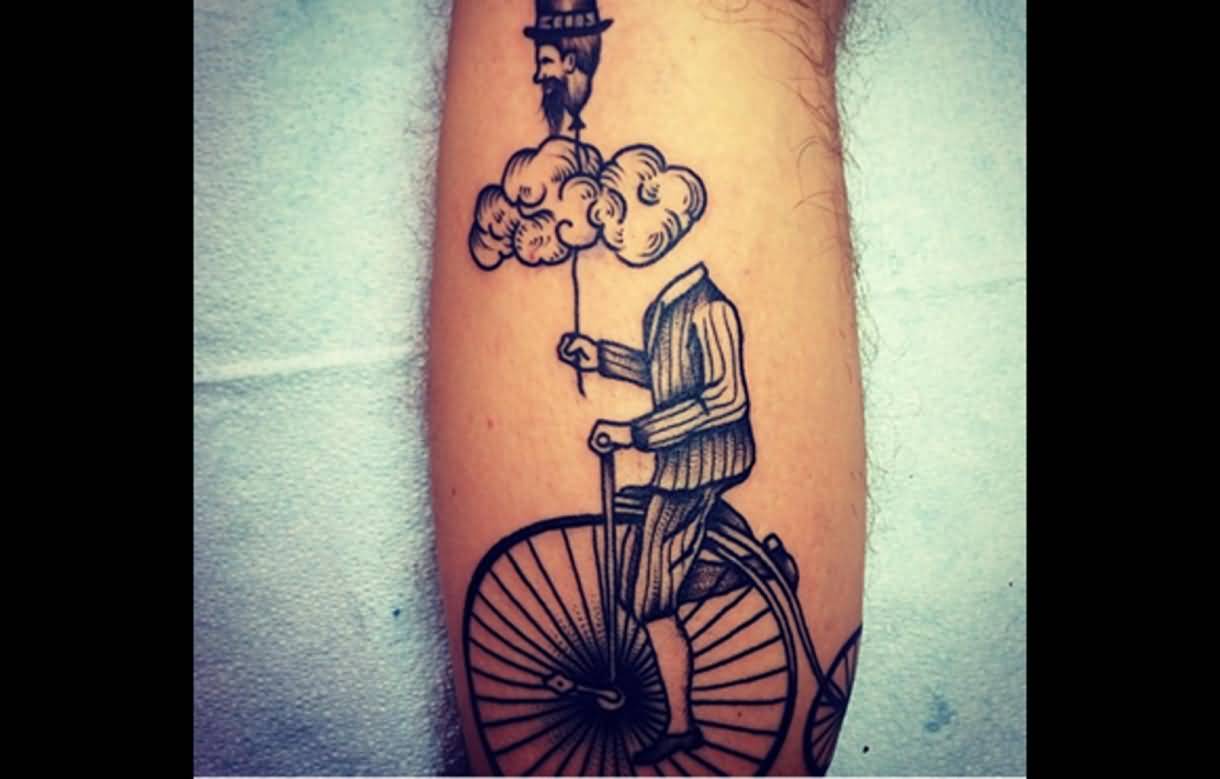 Headless Man Holding His Head Balloon Riding Cycle Tattoo