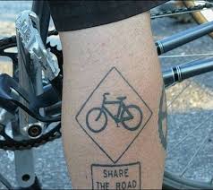 Nice Black Color Cycle In Diamond Shape Tattoo On Back Leg