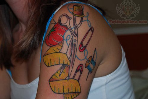 Scissor, Spool And Measure Tape Craft Tattoo On Left Shoulder