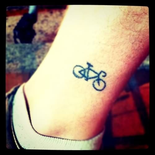 Smallest Black Ink Cycle Tattoo On Leg