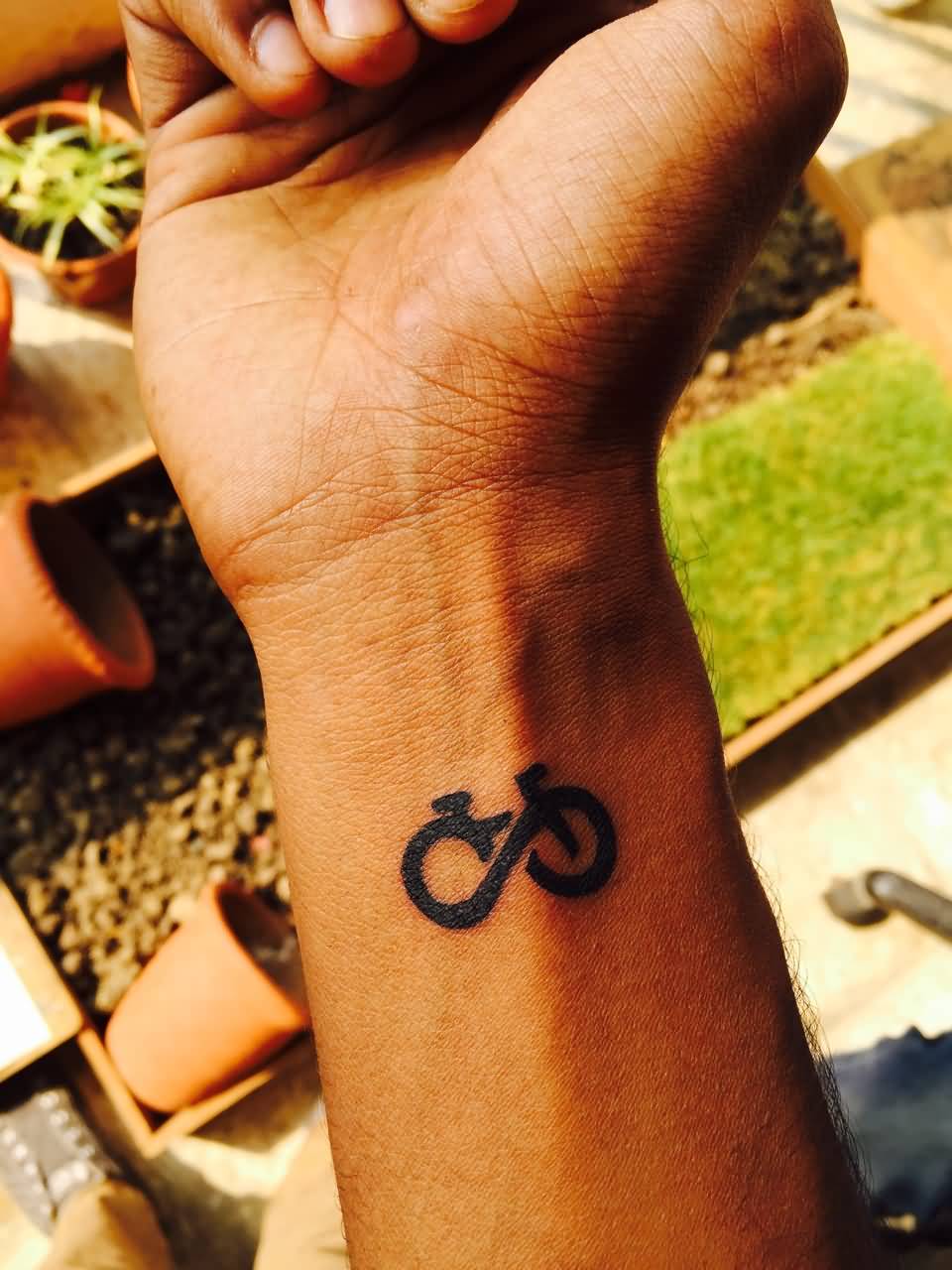 Tiny Cycle Infinity Tattoo On Wrist