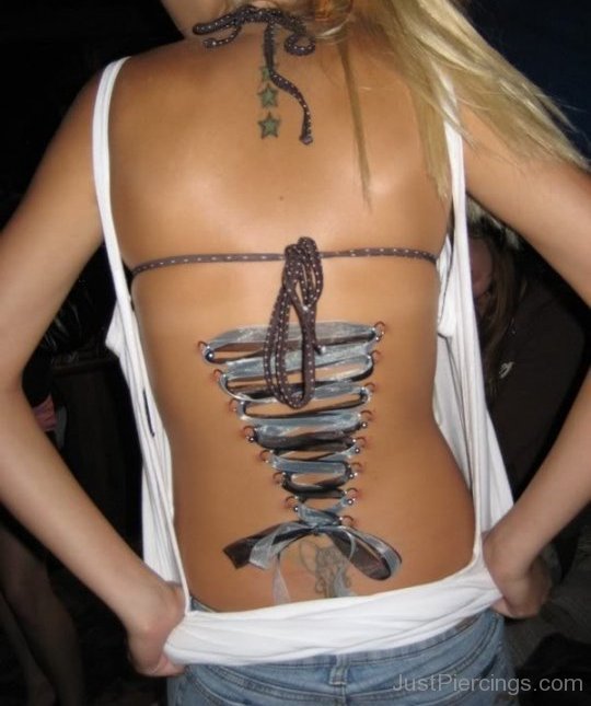 Grey Ribbon Corset Piercing On Girl Back Body