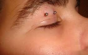 Eyelid Piercing With Silver Barbell