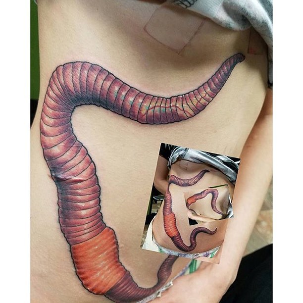 Large Earthworm Tattoo On Side Rib