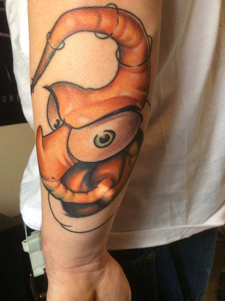 Nice Orange Color Earthworm Jim Head Tattoo On Forearm