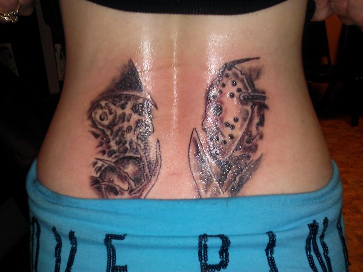 Small Grey And Black Jason Vs Freddy Tattoo On Lower back