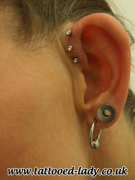 Double Lobe And Triple Forward Pinna Piercing