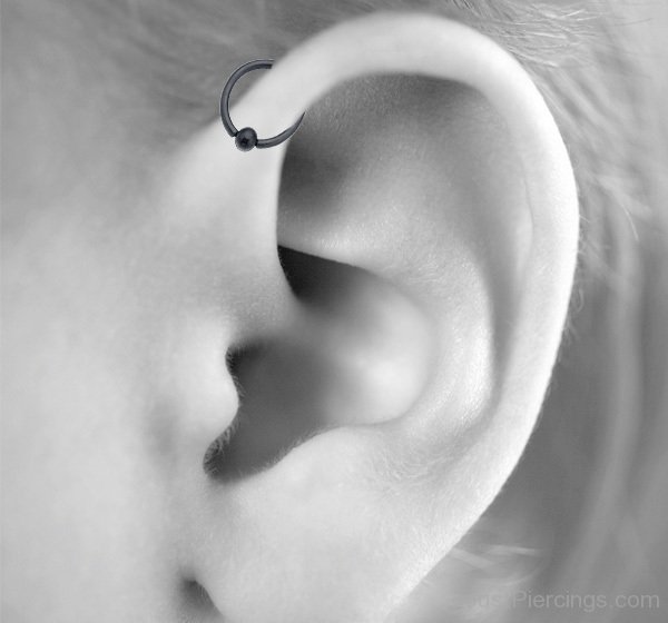 Forward Pinna Piercing With Black Hoop Ring