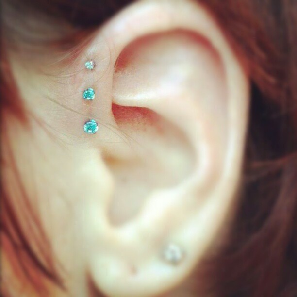 Forward Pinna Piercing With Blue Studs