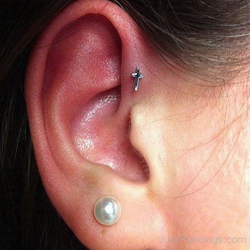 Forward Pinna Piercing With Cross Stud