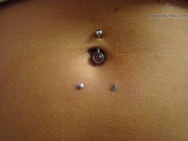 Horizontal Navel Piercing With Star Studs