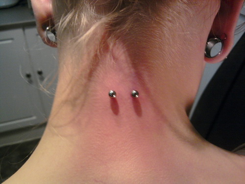 Horizontal Piercing On Girl Nape