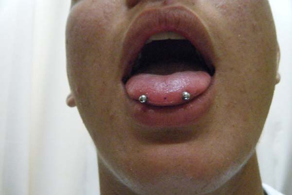 Horizontal Tongue Piercing With Silver Barbell