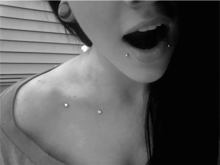 Lower Lip And Front Shoulder Piercing With Dermal Anchors